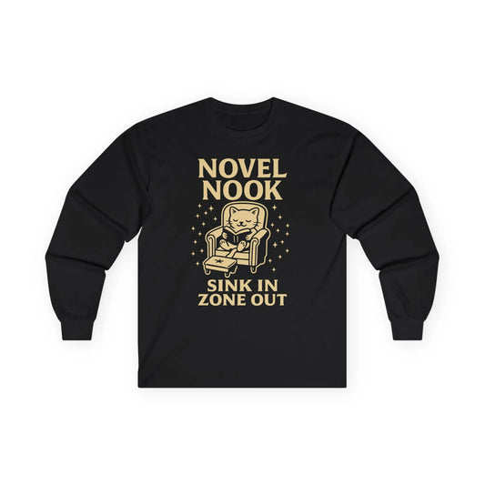 Novel Nook Long Sleeve shirt with cat in armchair, text 'Sink In Zone Out', perfect for book lovers and cozy moments.