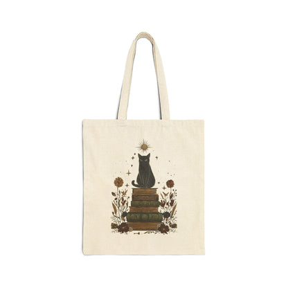 Mystic Cat & Books Tote Bag featuring a black cat atop vintage books with whimsical designs, perfect for book lovers.