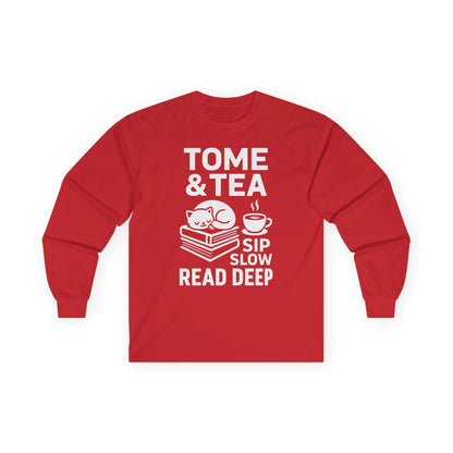 Tome & Tea long sleeve shirt featuring a cat on books, with text 'Sip Slow. Read Deep.' A cozy gift for book lovers.