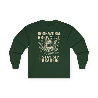 Whimsical cat in a cup on 'Bookworm Brew' shirt; reads 'I stay sip, I read on.' Perfect gift for book lovers and cat enthusiasts.