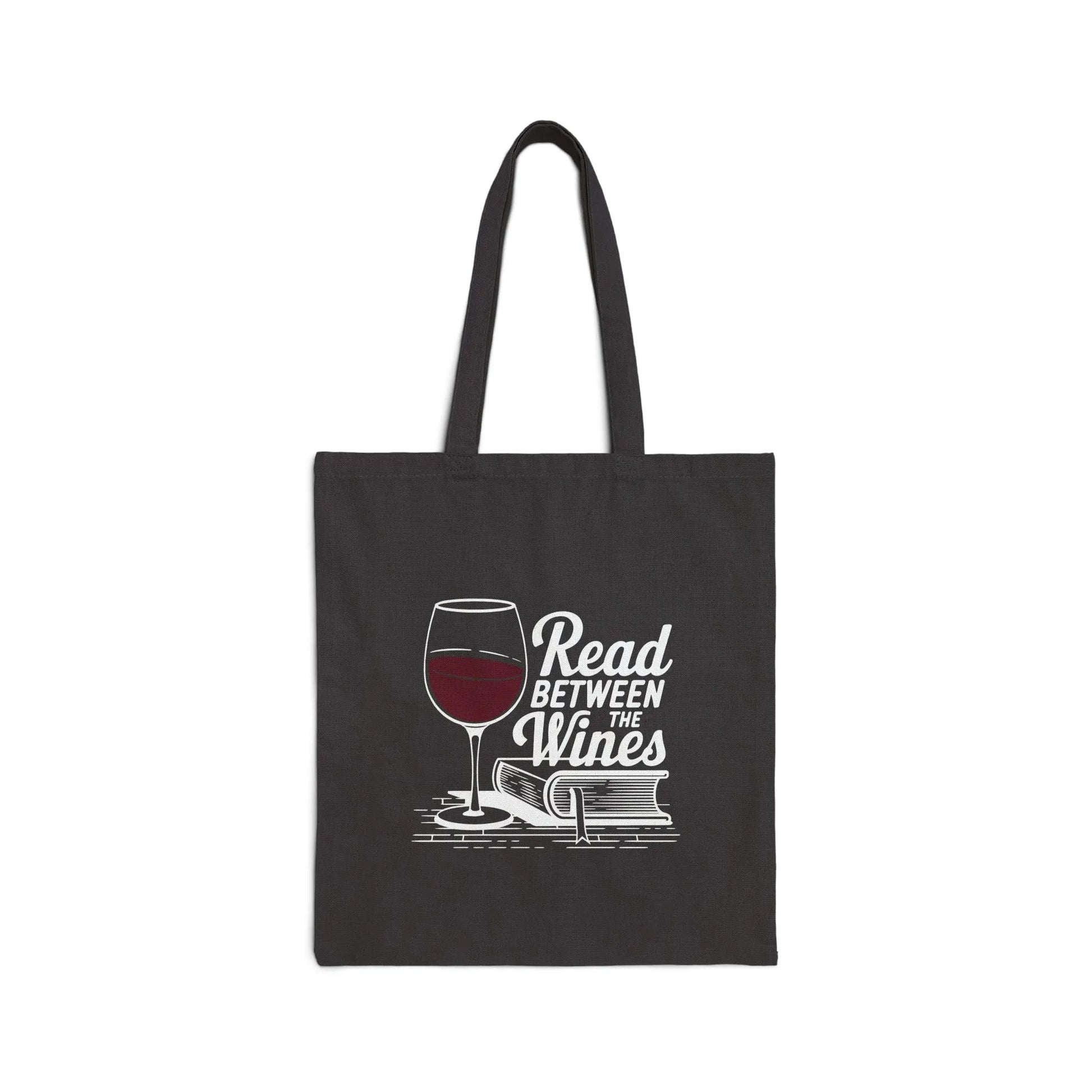Stylish black tote bag featuring 'Read Between the Wines' with a glass of red wine and books. Perfect for book lovers!