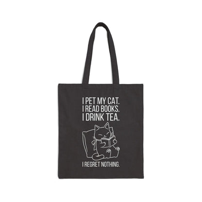 Purrfect Tea & Tales Tote Bag featuring a cozy cat with text: 'I pet my cat. I read books. I drink tea. I regret nothing.' Perfect for book lovers!