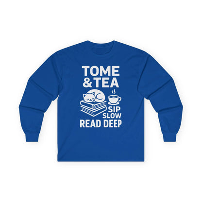 Cozy blue long sleeve tee with a cat, books, and "Tome & Tea. Sip Slow. Read Deep" for book lovers.