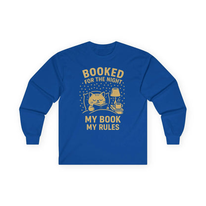 Cozy blue long sleeve shirt featuring a cartoon cat, lamp, and text: 'Booked for the Night, My Book, My Rules'—perfect for book lovers.