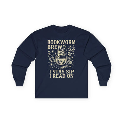 Cozy navy long sleeve featuring a whimsical cat in a cup, text "Bookworm Brew I Stay Sip I Read On", perfect gift for book lovers.