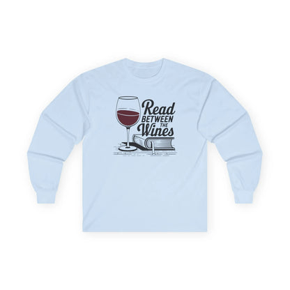 Read Between the Wines Long Sleeve, light blue long sleeve shirt, wine and book graphic, cozy reading outfit.