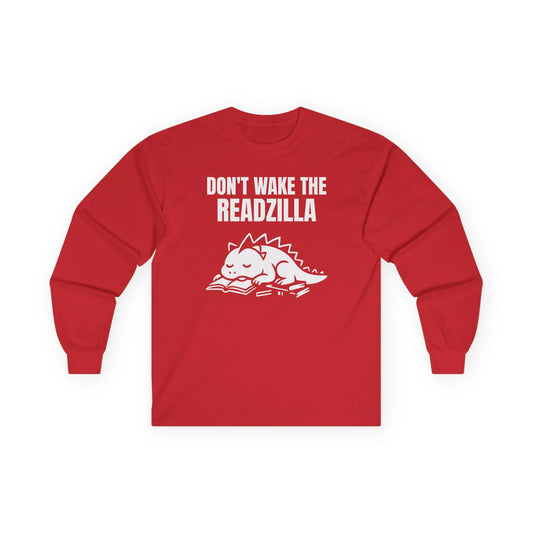 A cozy Readzilla Nap Mode Long Sleeve tee with a sleepy dinosaur and text 'Don't Wake the Readzilla', perfect for book lovers.