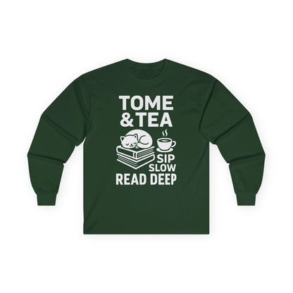Cozy long sleeve shirt with a cat on books and text: 'Tome & Tea. Sip Slow. Read Deep.' A perfect gift for book lovers.