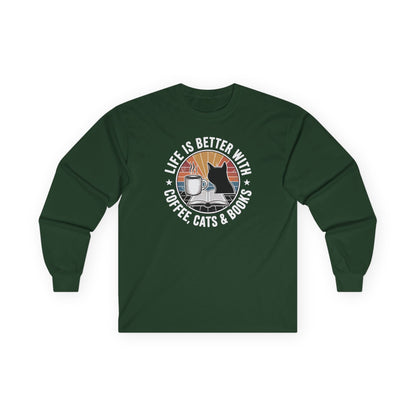 Sunset Reads & Whiskers Long Sleeve featuring a cozy design with a cat, coffee, and books, perfect for book lovers.