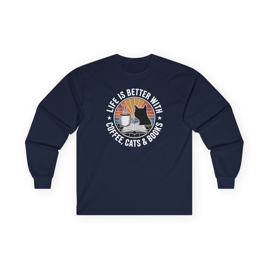 Sunset Reads & Whiskers Long Sleeve featuring coffee, cats, and books design on a navy long sleeve shirt for book lovers.