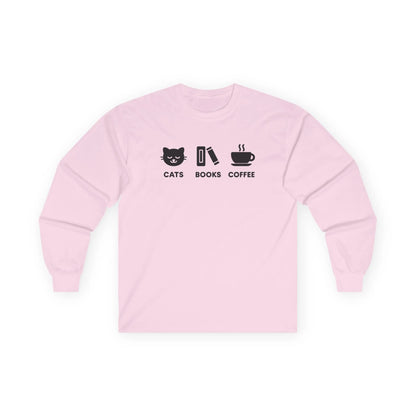 Holy Trinity Long Sleeve shirt in pink featuring playful graphics of a cat, book, and coffee for cozy readers.