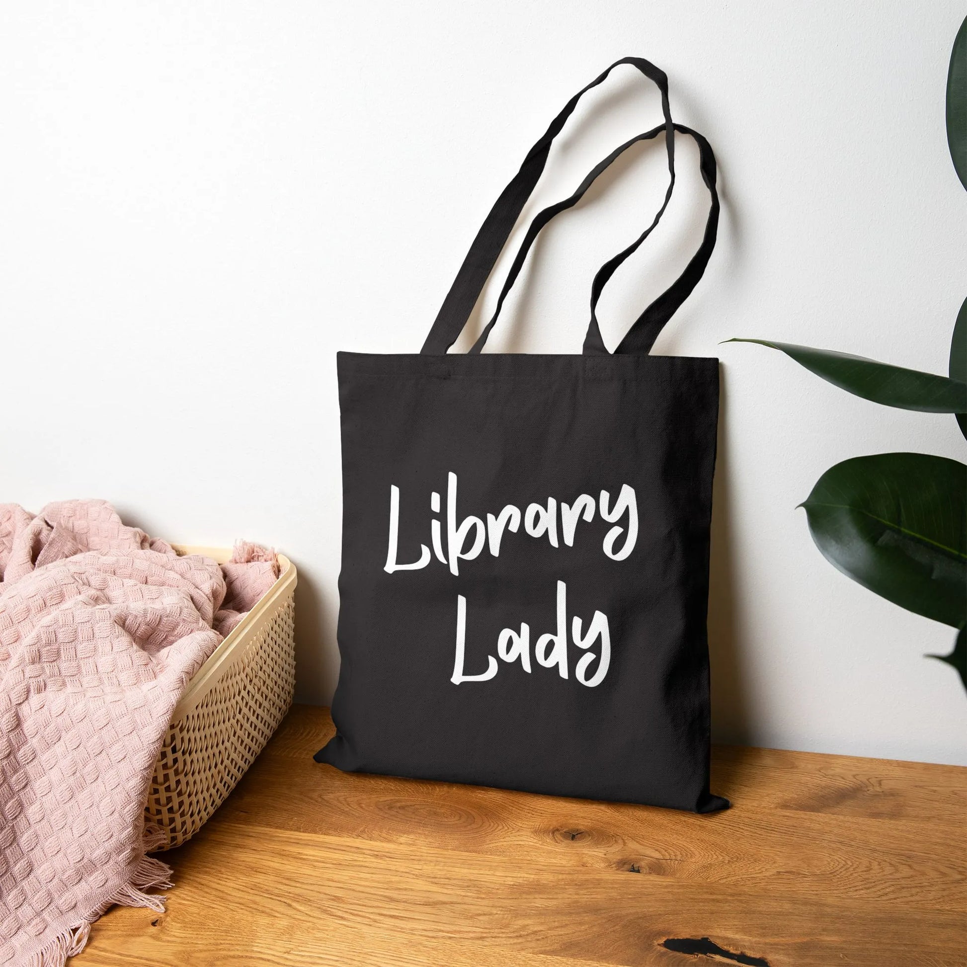 Library Lady Tote Bag with charming handwritten design, perfect for book lovers who enjoy cozy reading vibes.
