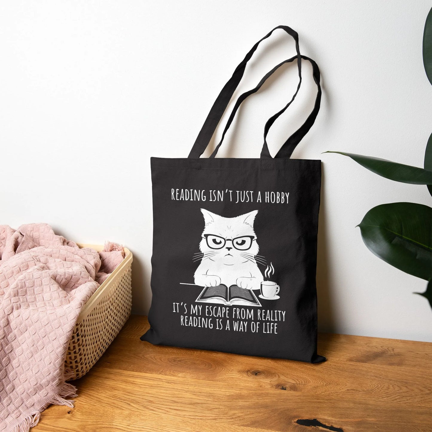 Reading Way of Life Tote Bag featuring a cat design with the quote about reading as a lifestyle, durable canvas material.