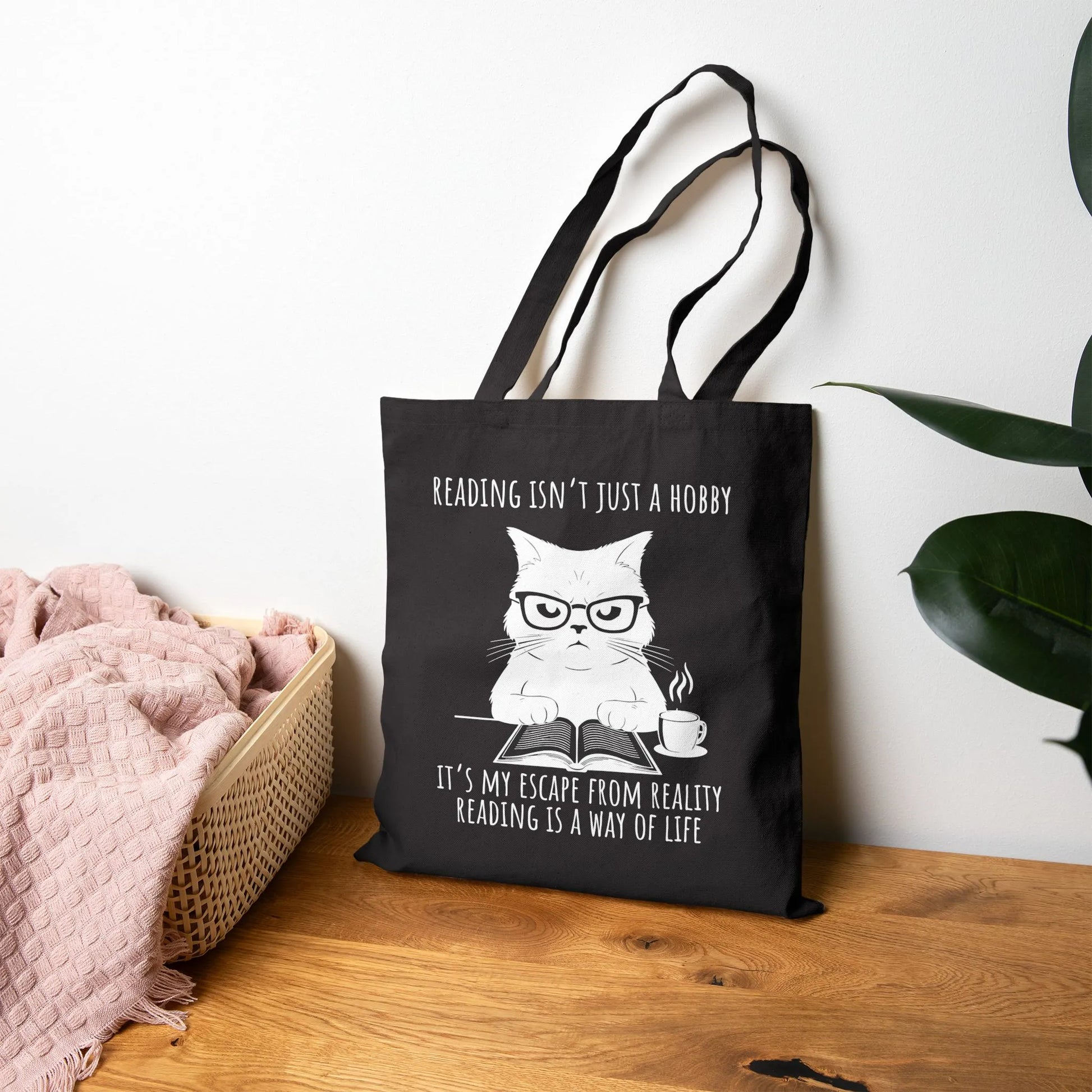 Reading Way of Life Tote Bag featuring a cat design with the quote about reading as a lifestyle, durable canvas material.