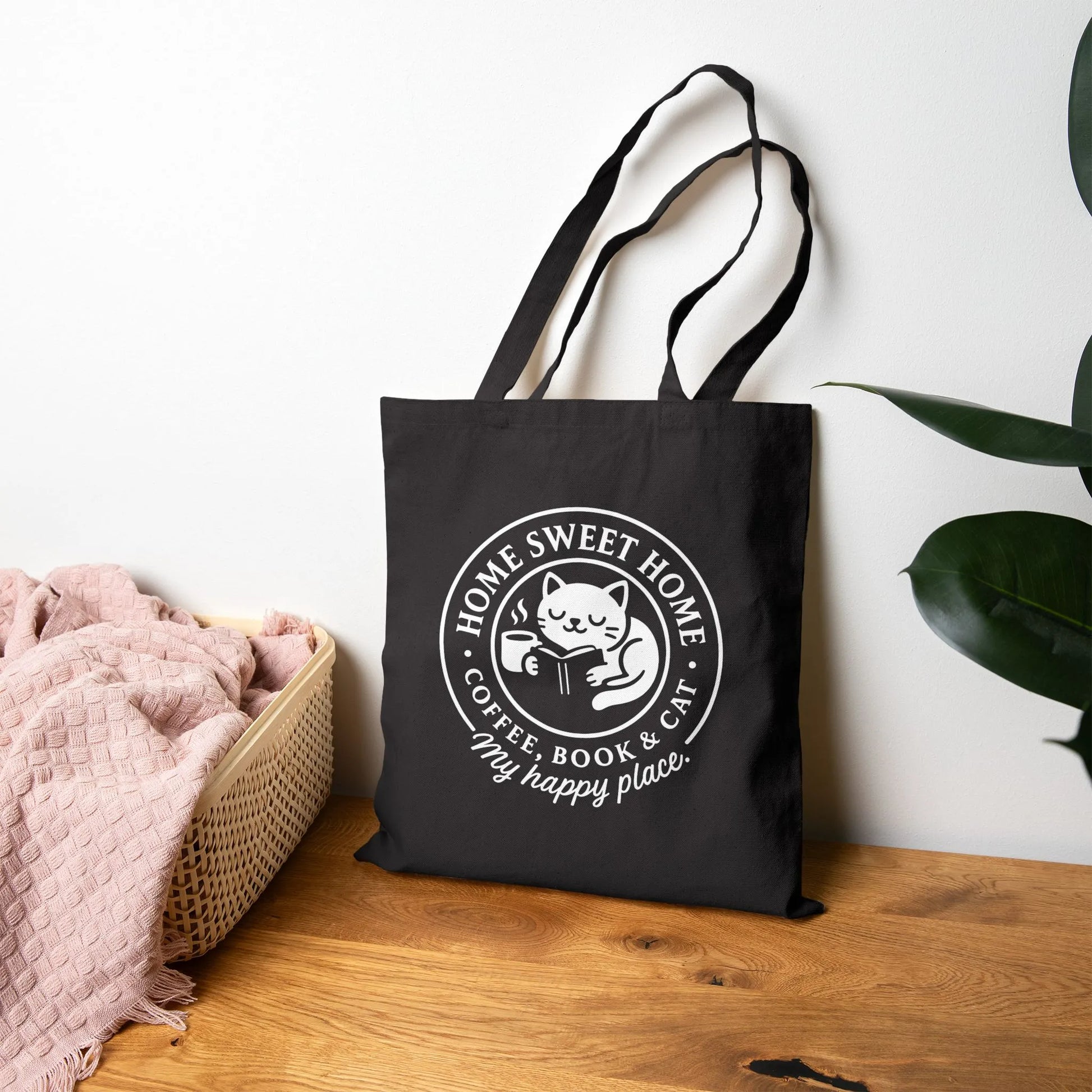 Cozy Cat Haven Tote Bag showcasing a cat with a book and coffee, perfect for book lovers enjoying cozy moments anywhere.