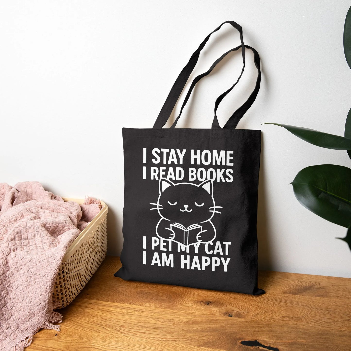 Happy Cat Reader Tote Bag featuring a cute kitty reading a book with the motto: 'I stay home, I read books, I pet my cat, I am happy.' Perfect for book lovers!