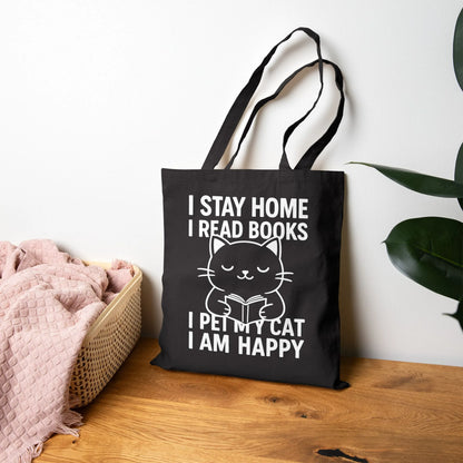 Happy Cat Reader Tote Bag featuring a cute kitty reading a book with the motto: 'I stay home, I read books, I pet my cat, I am happy.' Perfect for book lovers!