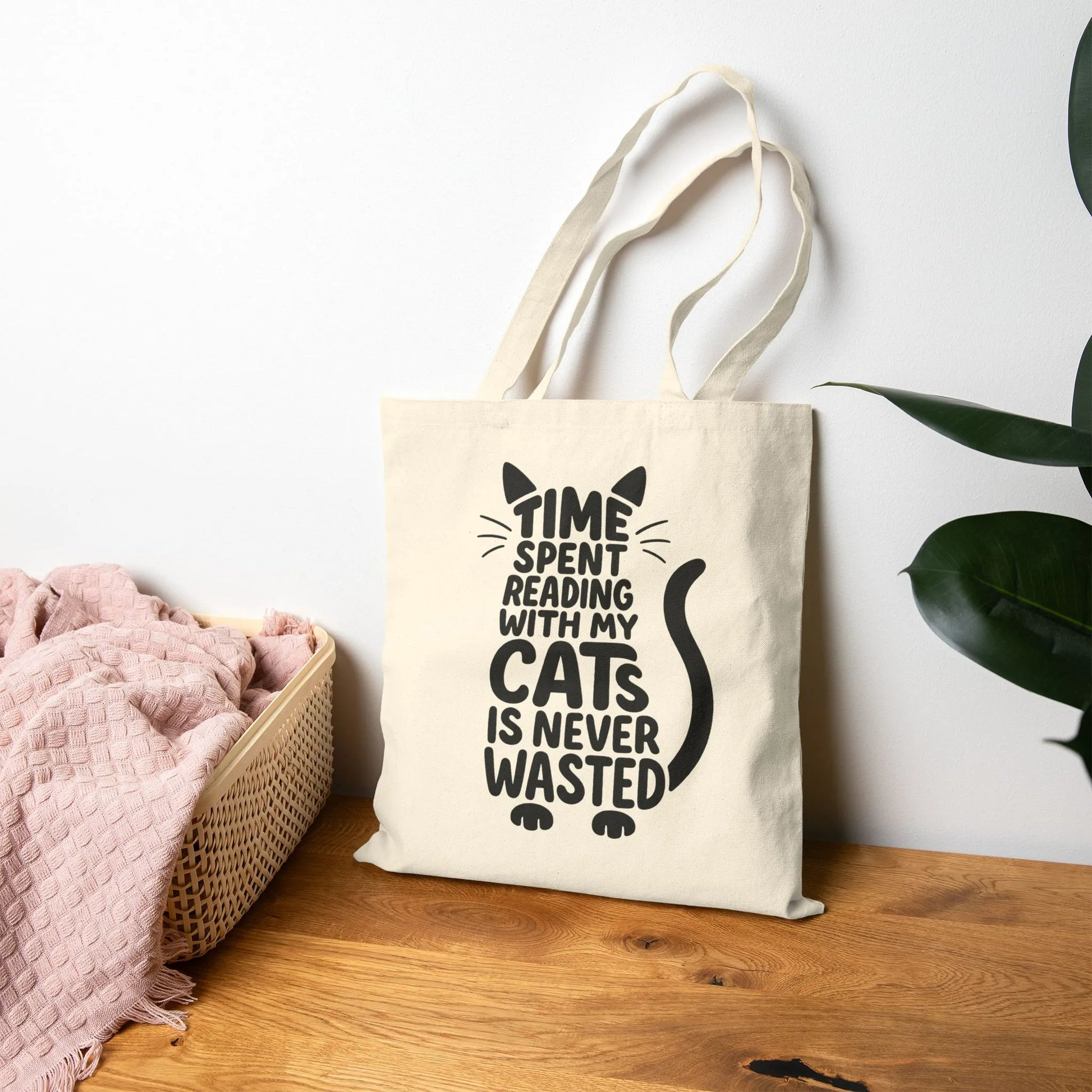 Never Wasted with Cats Tote Bag featuring playful cat typography and the phrase 'TIME SPENT READING WITH MY CATS IS NEVER WASTED.'