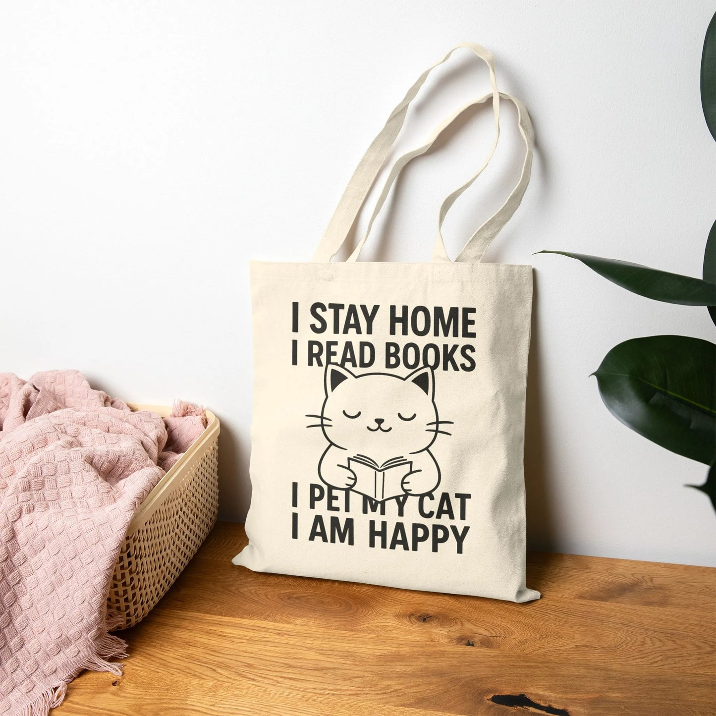 Happy Cat Reader Tote Bag featuring a cute cat illustration with text: 'I STAY HOME I READ BOOKS I PET MY CAT I AM HAPPY'.
