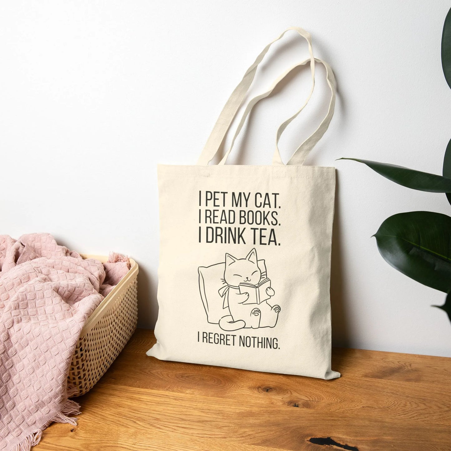 Purrfect Tea & Tales Tote Bag featuring a cozy cat reading with tea, perfect for book lovers and gifts for readers.