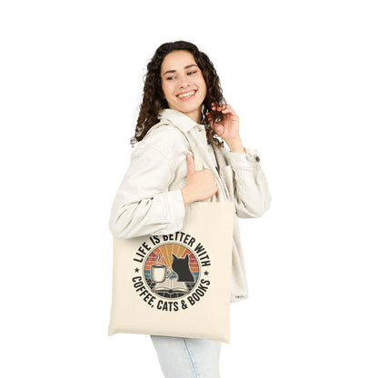 Sunset Reads & Whiskers Tote Bag featuring a warm design with cats, coffee, and books, perfect for book lovers and gift-giving.