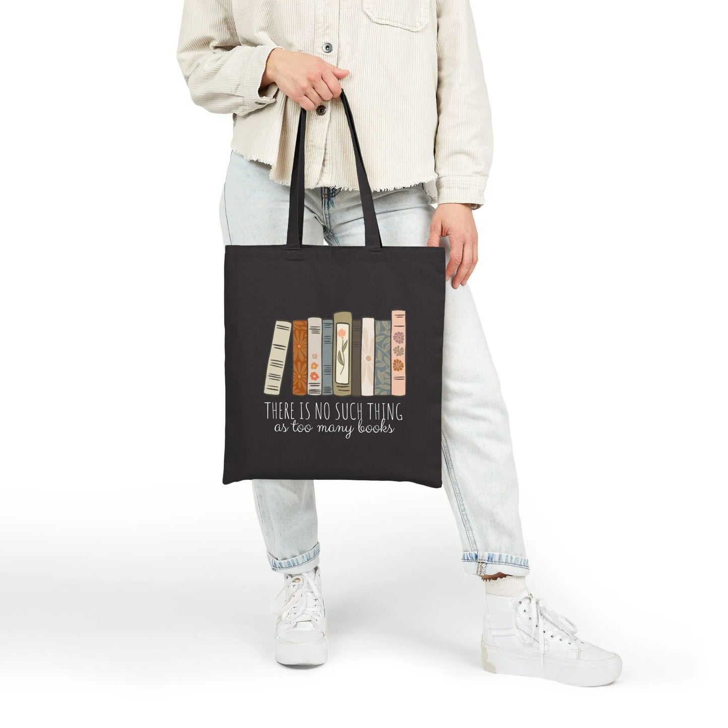 Too Many Books Tote Bag featuring a colorful book design on a durable canvas material, perfect for book lovers.