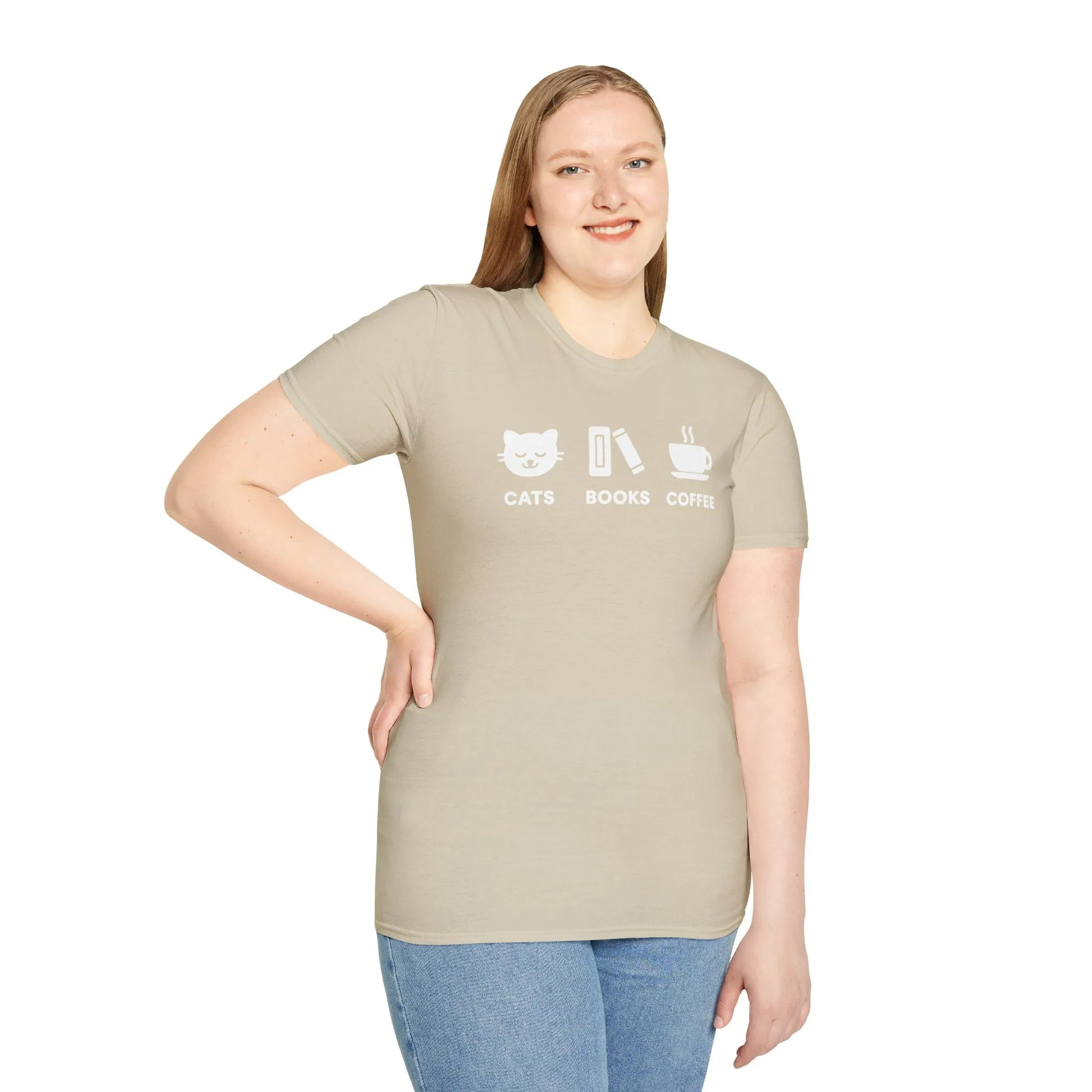 A smiling woman wearing a cozy 'Cats, Books, Coffee' t-shirt, perfect for book lovers and a witty gift for readers.