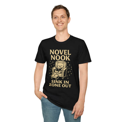 Cozy Novel Nook T-Shirt featuring a cat in an armchair with 'Sink In Zone Out' – perfect for book lovers and cat enthusiasts!
