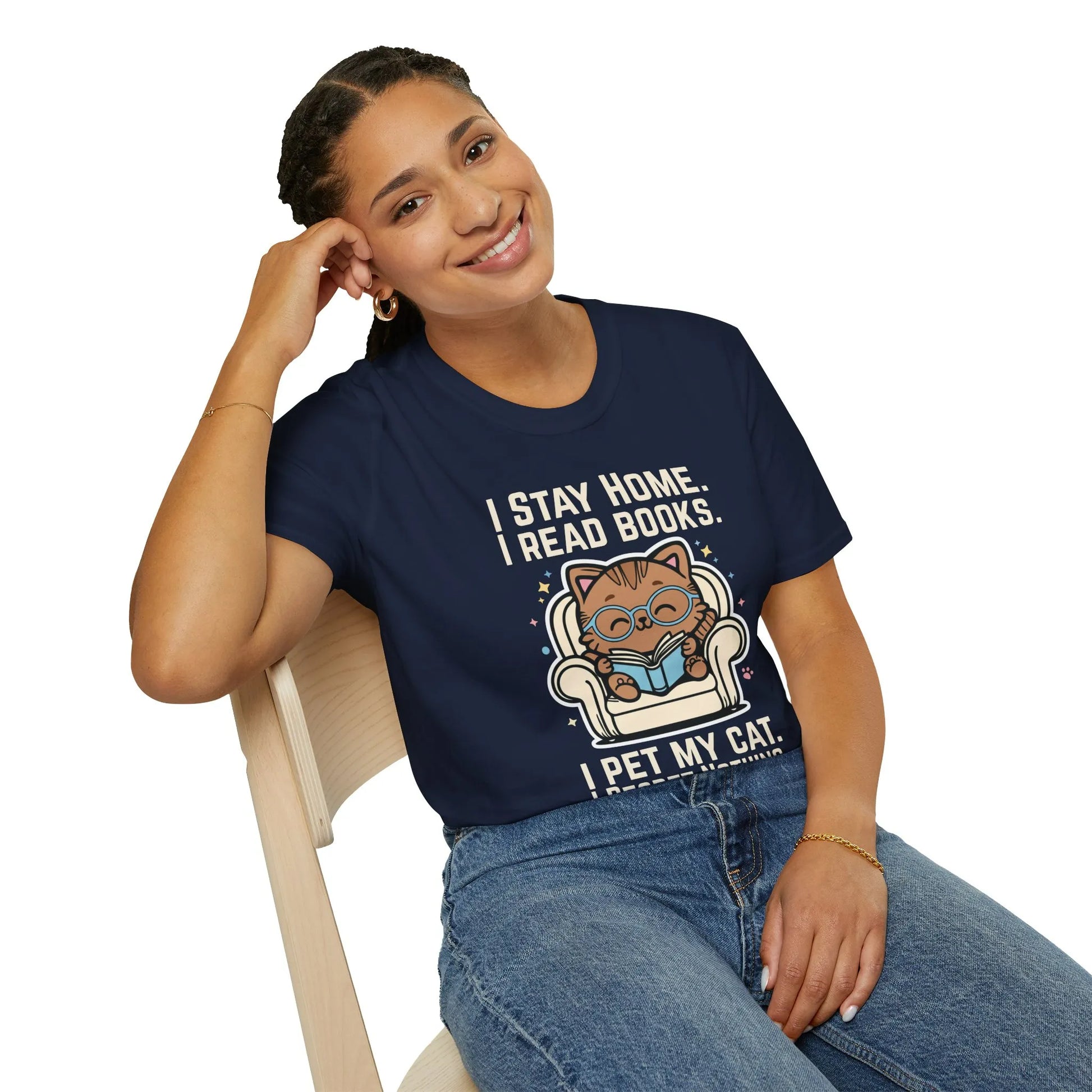 Starry Cat Reader T-Shirt featuring a cute cat reading with text: 'I stay home, I read books, I pet my cat.' Perfect for book lovers!