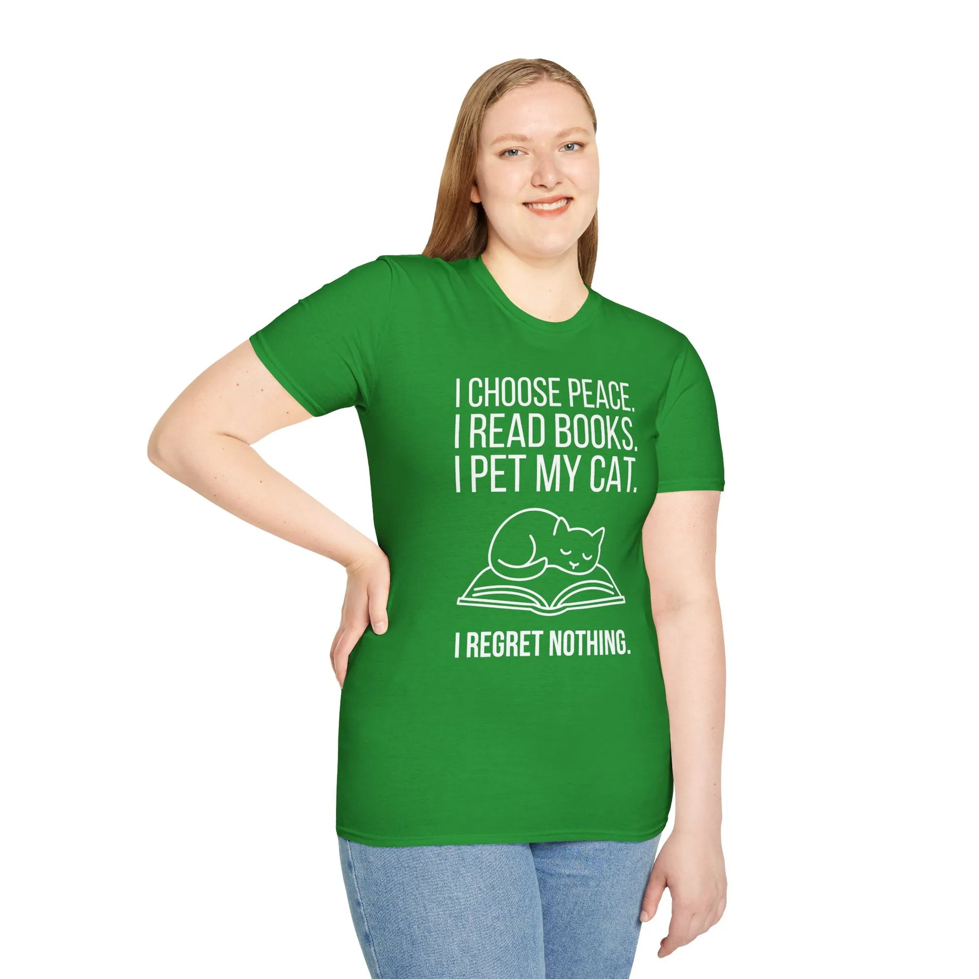 A green tee featuring a cozy cat on a book with the text: 'I choose peace. I read books. I pet my cat. I regret nothing.' Perfect for book lovers.