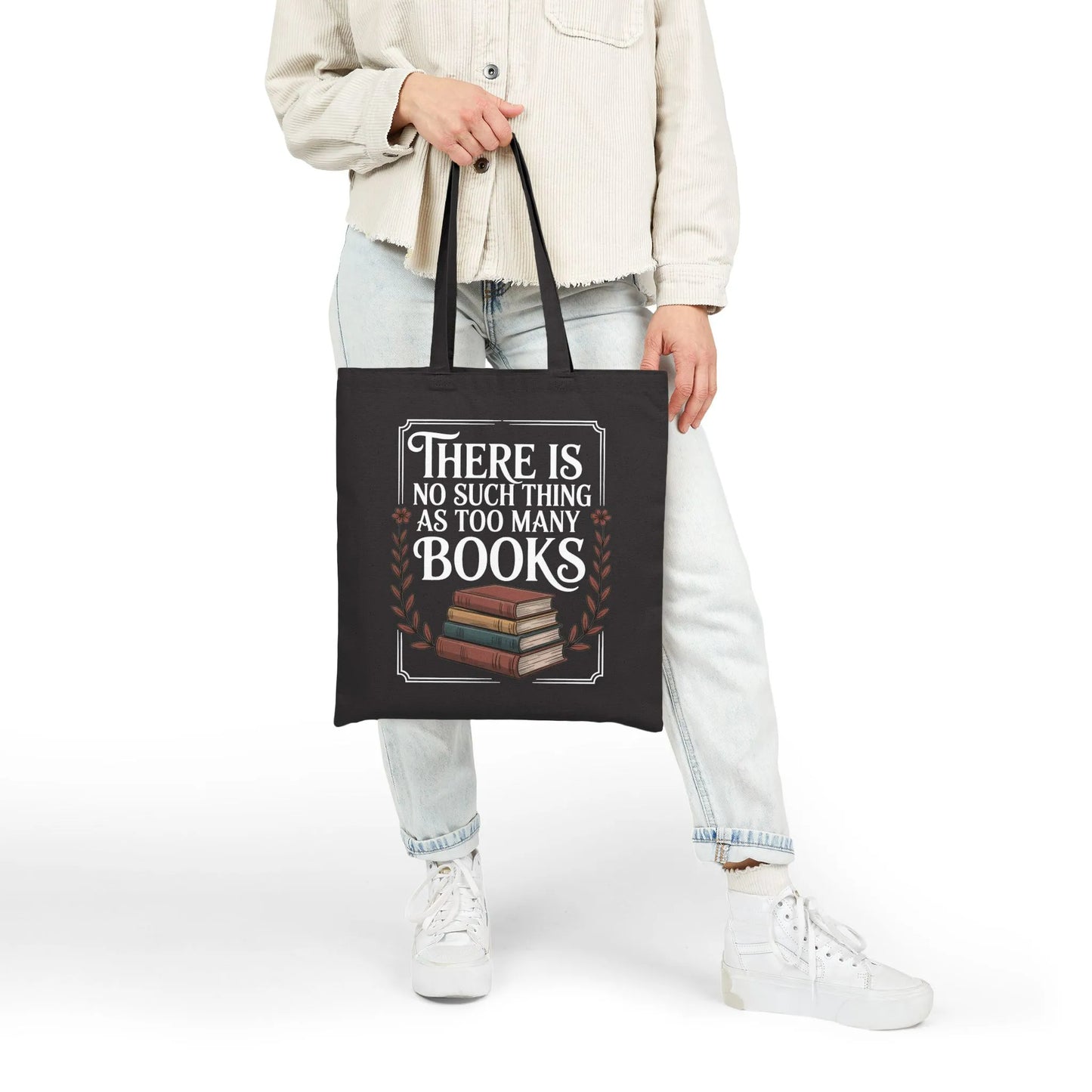 Too Many? Never. Tote Bag in black canvas featuring "There is no such thing as too many books" design, perfect for book lovers.