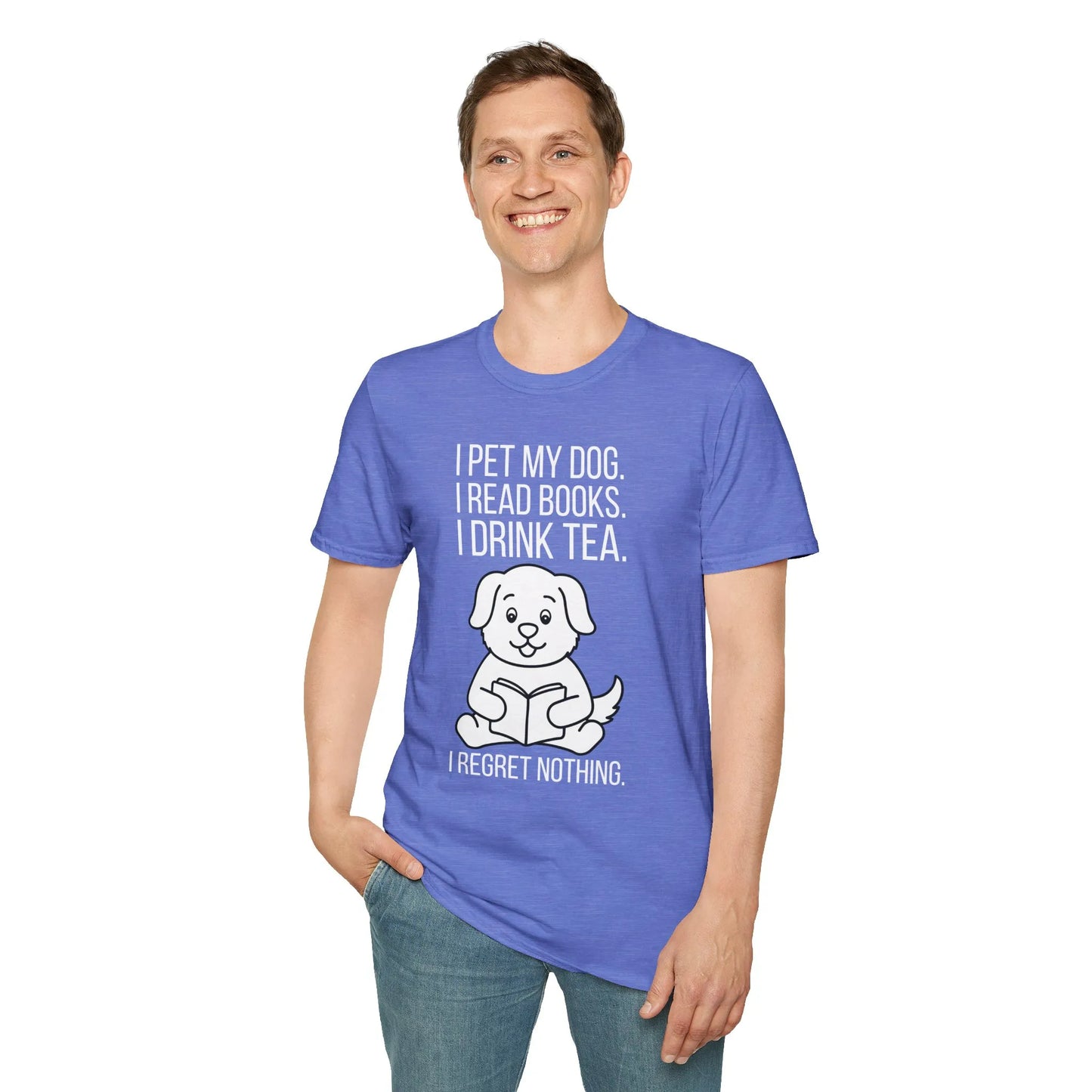A man wearing a relaxed fit Tea, Tales & Tail Wags T-Shirt, enjoying a cozy reading lifestyle with a dog illustration in a book nook.