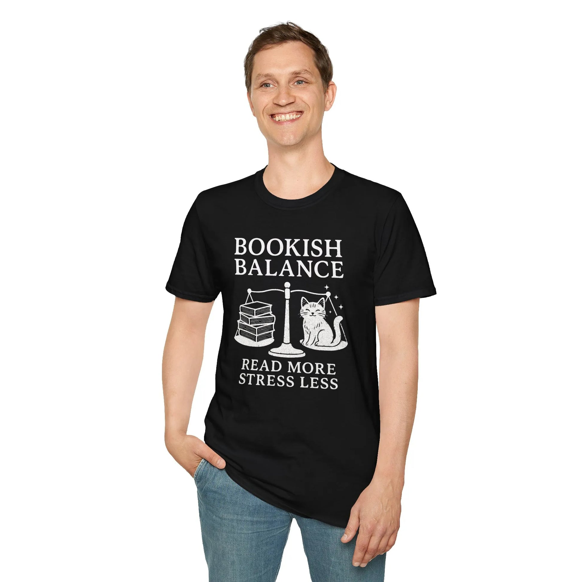 Smiling man in a Bookish Balance t-shirt with a cat and books design, reading humor for book lovers.