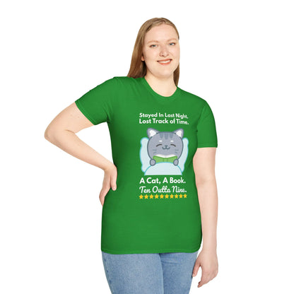 Playful green t-shirt featuring a cute cat and text: 'Stayed In Last Night. A Cat, A Book. Ten Outta Nine.' Perfect for book lovers!