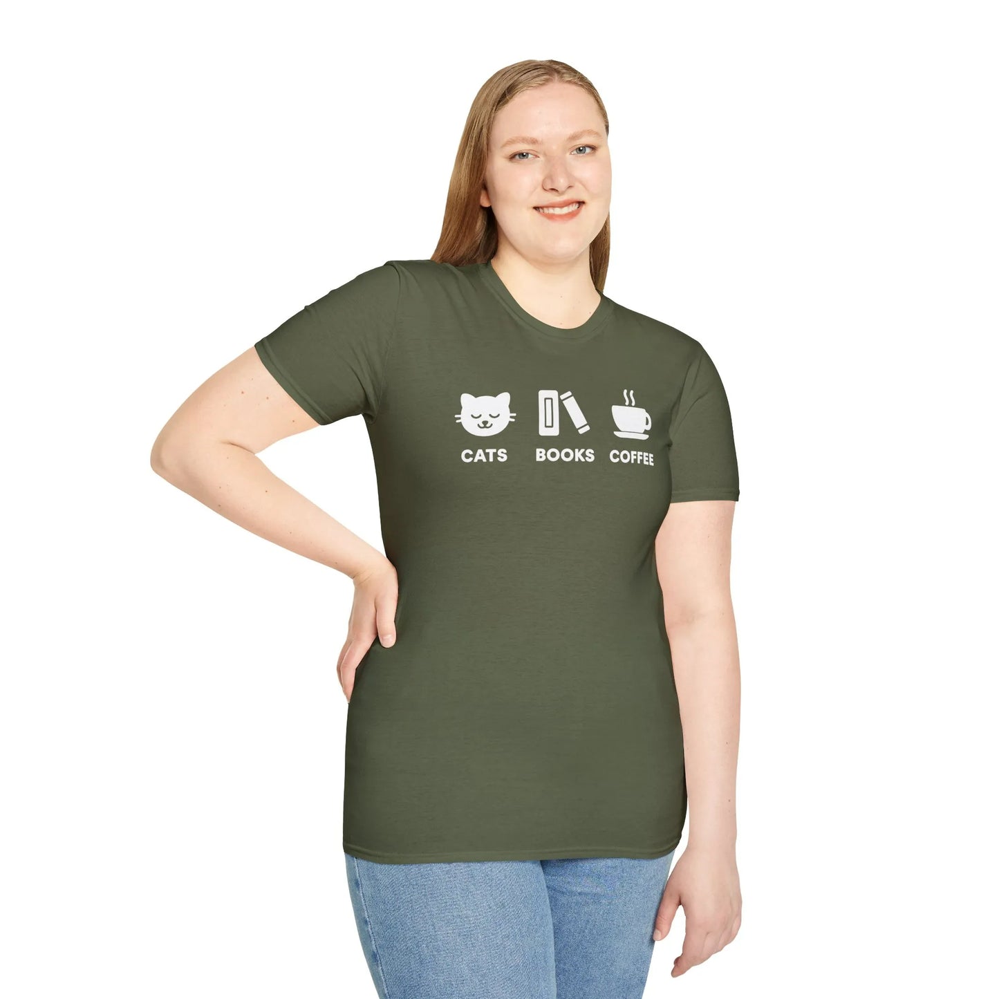 A woman wearing a relaxed fit Holy Trinity T-Shirt, showcasing cat, books, and coffee icons, perfect for cozy reading lovers.