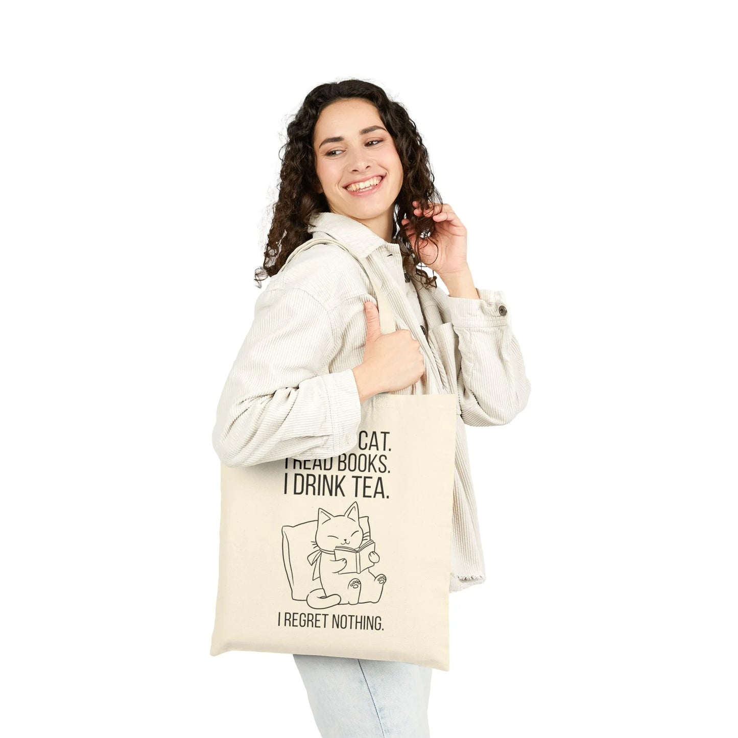 Purrfect Tea & Tales Tote Bag featuring a cozy cat, reading books, and humorous text for book lovers.