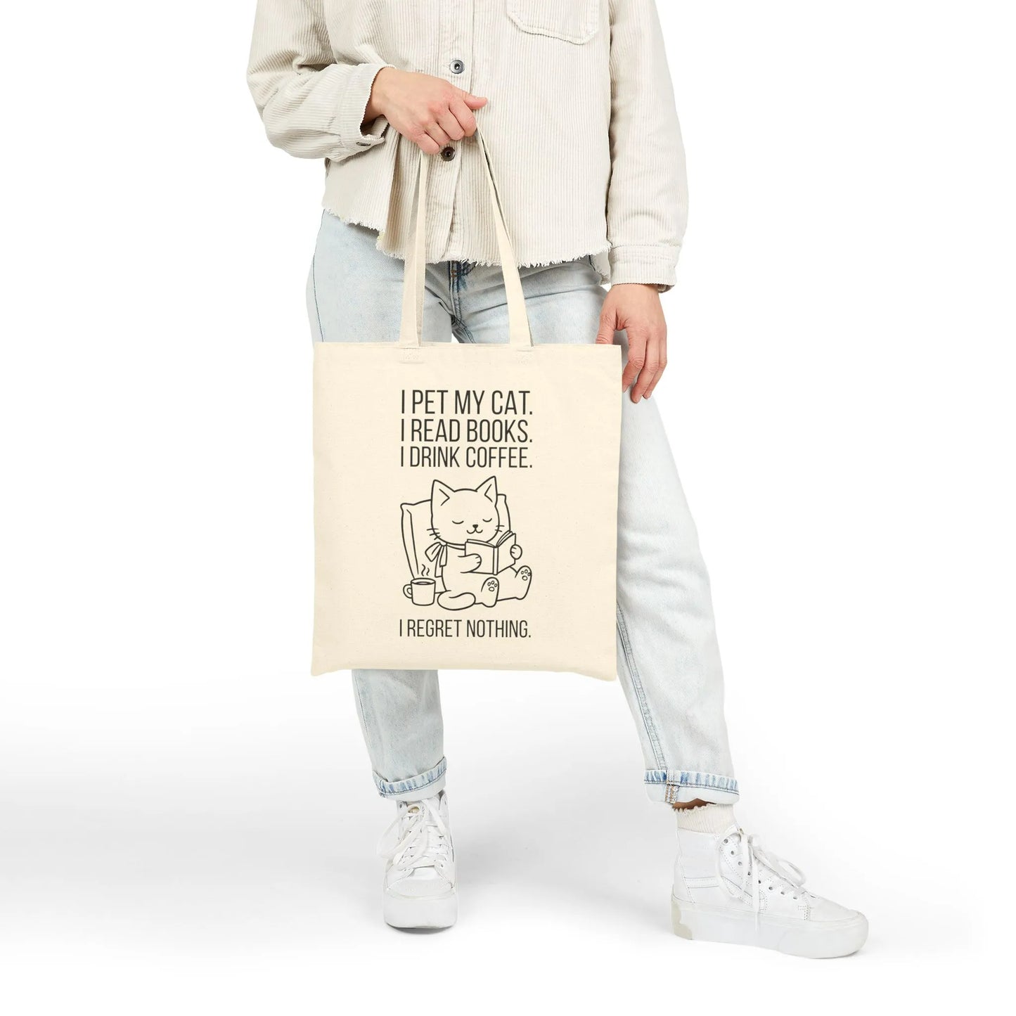 Person holding a Cat. Books. Coffee. Tote Bag featuring a playful cat illustration and humorous reading quote.