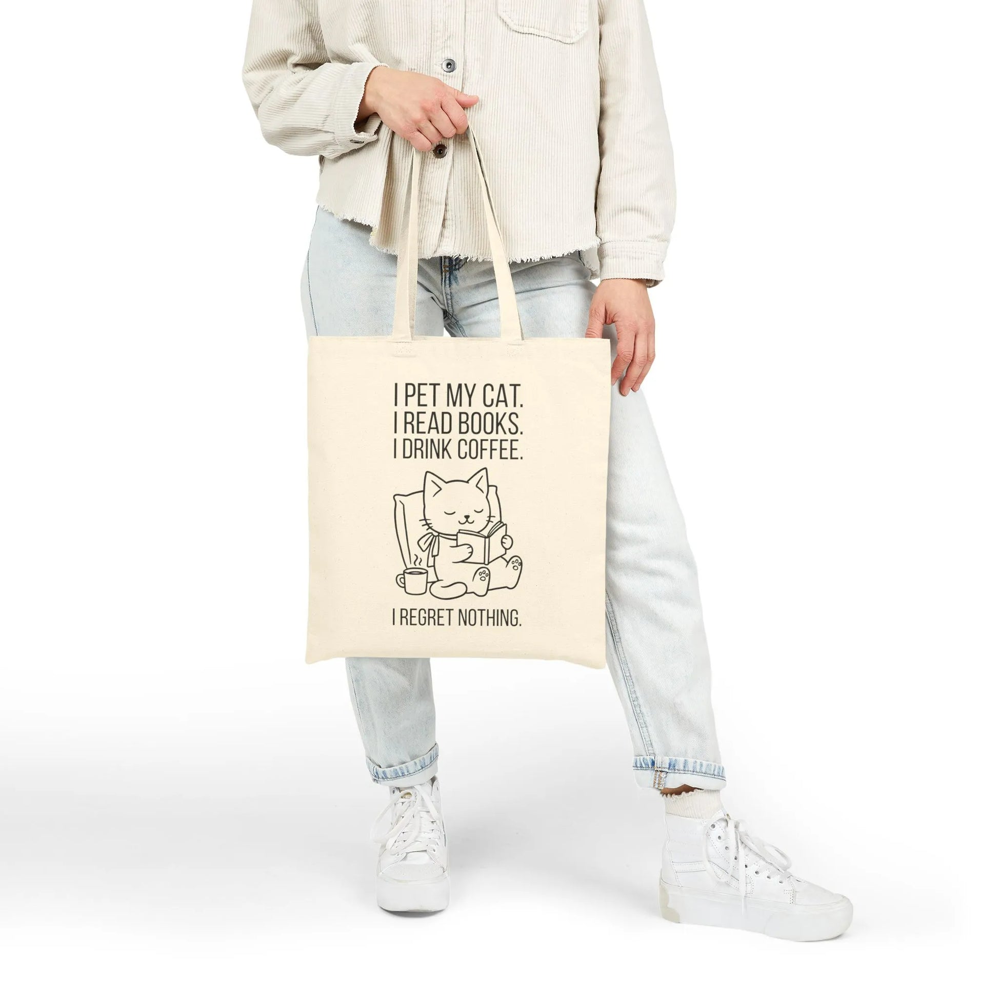 Person holding a Cat. Books. Coffee. Tote Bag featuring a playful cat illustration and humorous reading quote.
