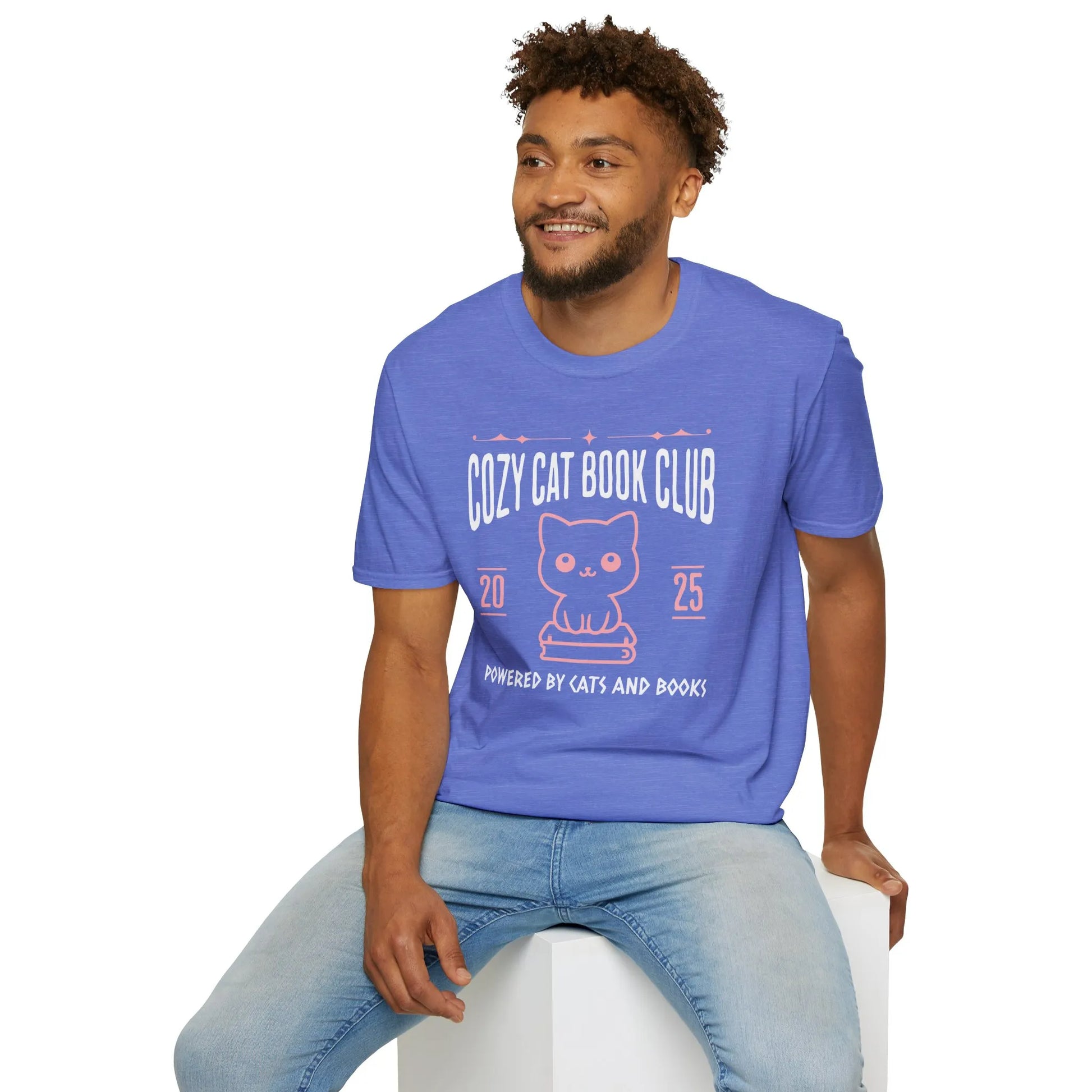 Cozy Cat Book Club T-Shirt features a cute cat illustration and humorous text, perfect for book lovers who enjoy cozy reading nights.