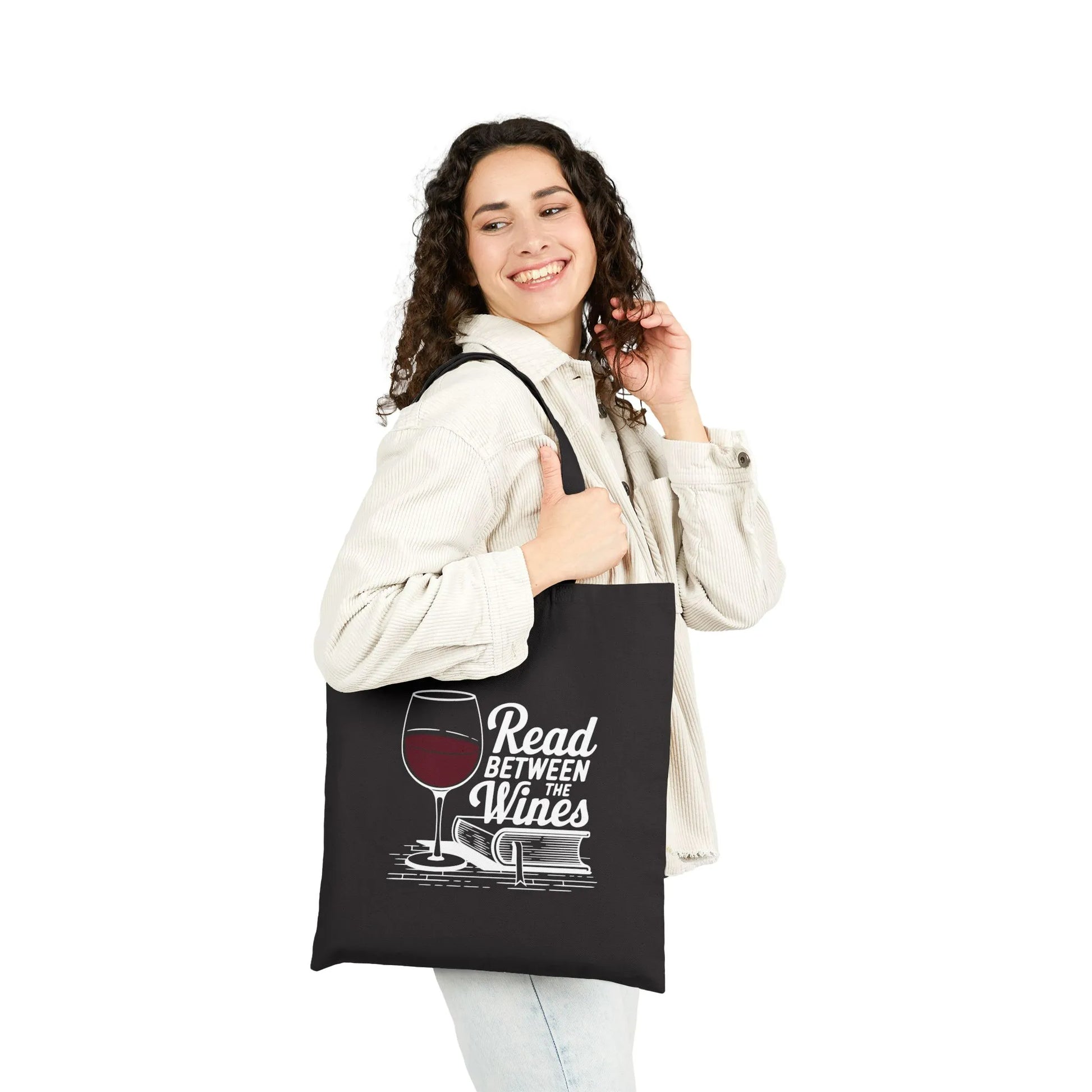 Read Between the Wines Tote Bag showcasing a wine glass illustration, perfect for book lovers and cozy readers who enjoy wine.
