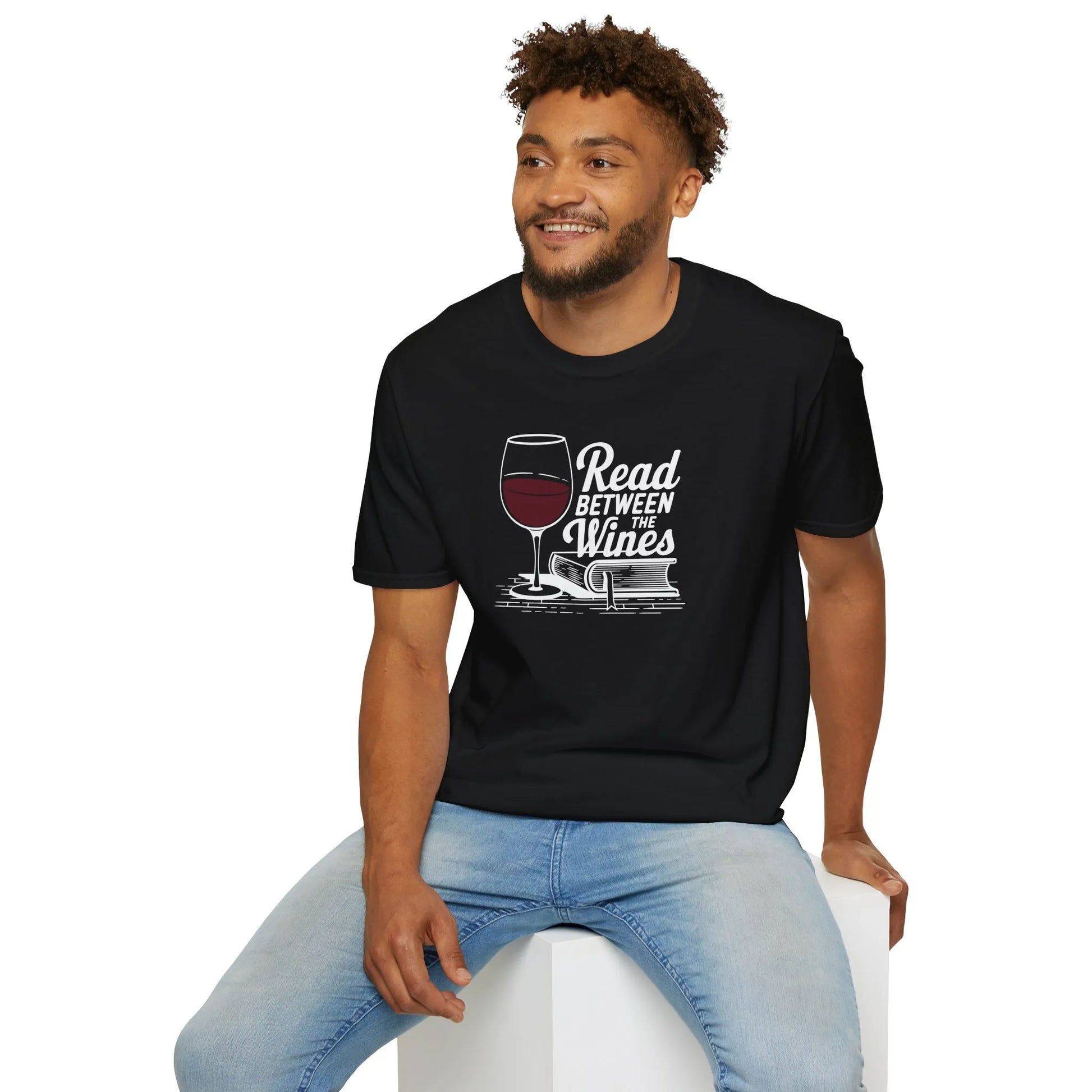 Read Between the Wines T-Shirt on a relaxed fit unisex model, featuring wine glass & book illustration, perfect cozy outfit for book lovers.
