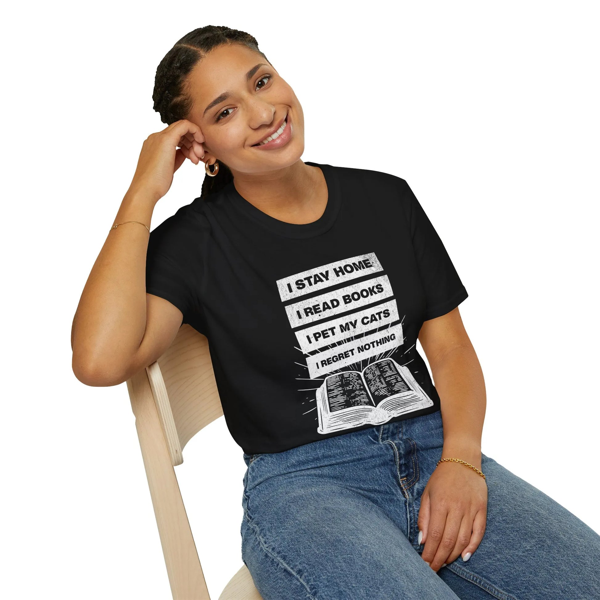 Stay Home Reader T-Shirt featuring a fun design with text: 'I STAY HOME. I READ BOOKS. I PET MY CATS. I REGRET NOTHING.' Perfect for cozy reading days.