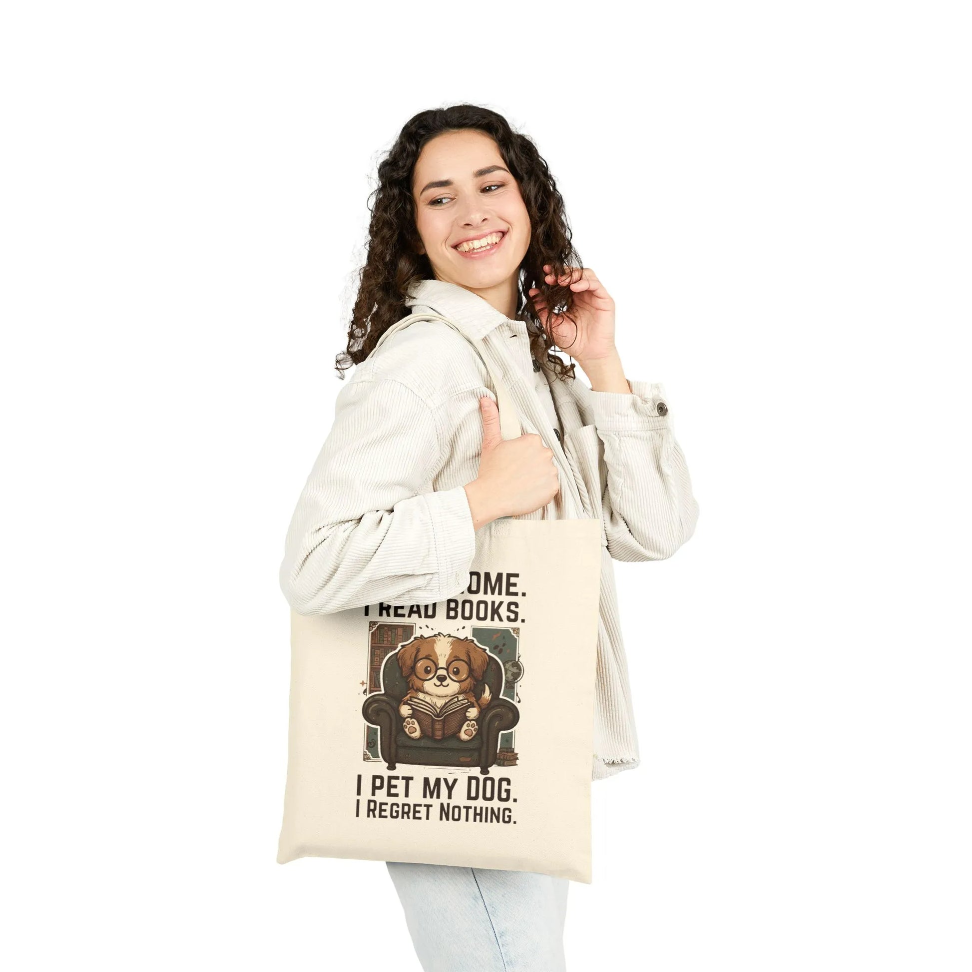 Woman holding a library dog reader tote bag with a dog reading a book design, perfect for dog and book lovers.