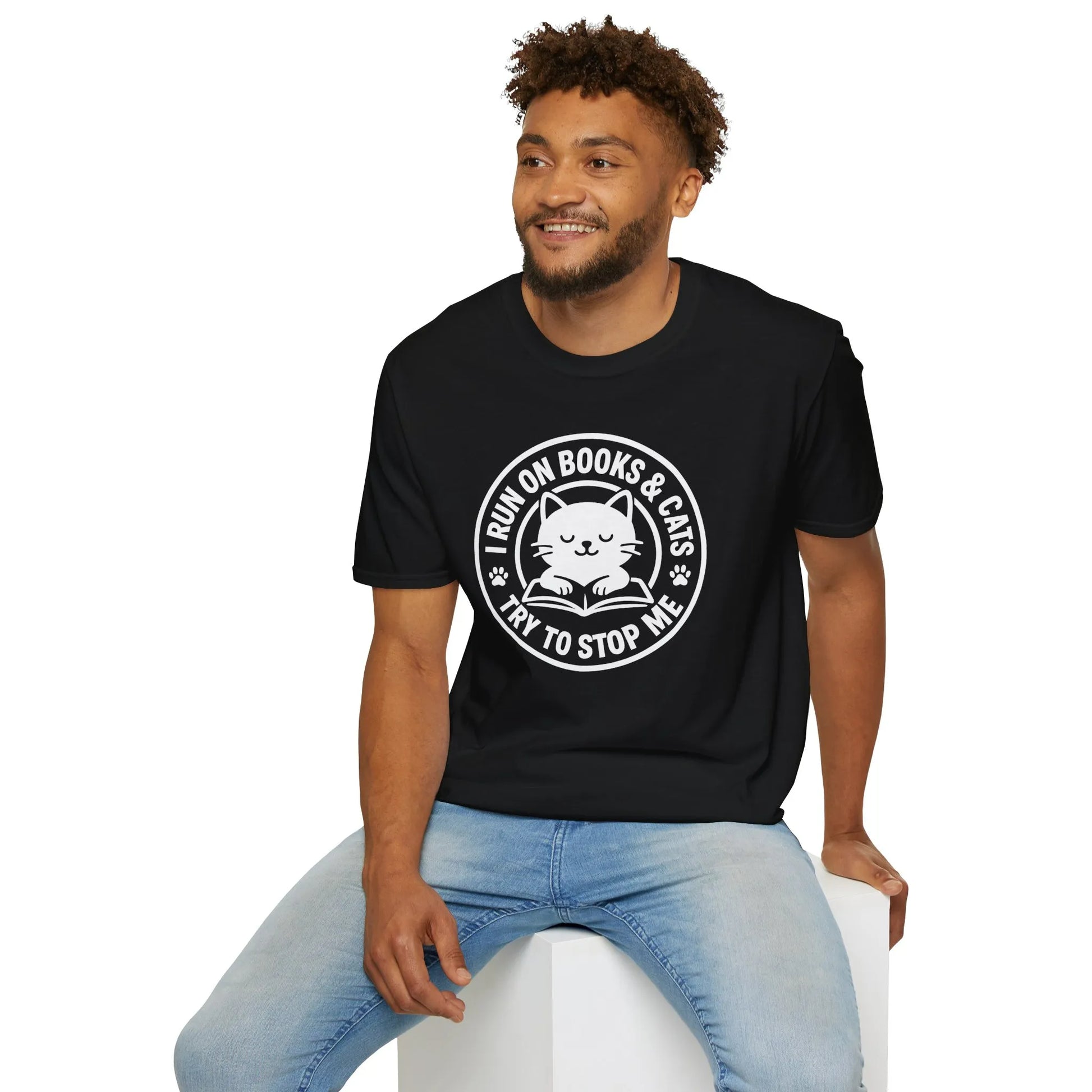 Man in a black cat reading shirt with 'I RUN ON BOOKS & CATS - TRY TO STOP ME' design, perfect for book lovers and cat enthusiasts.