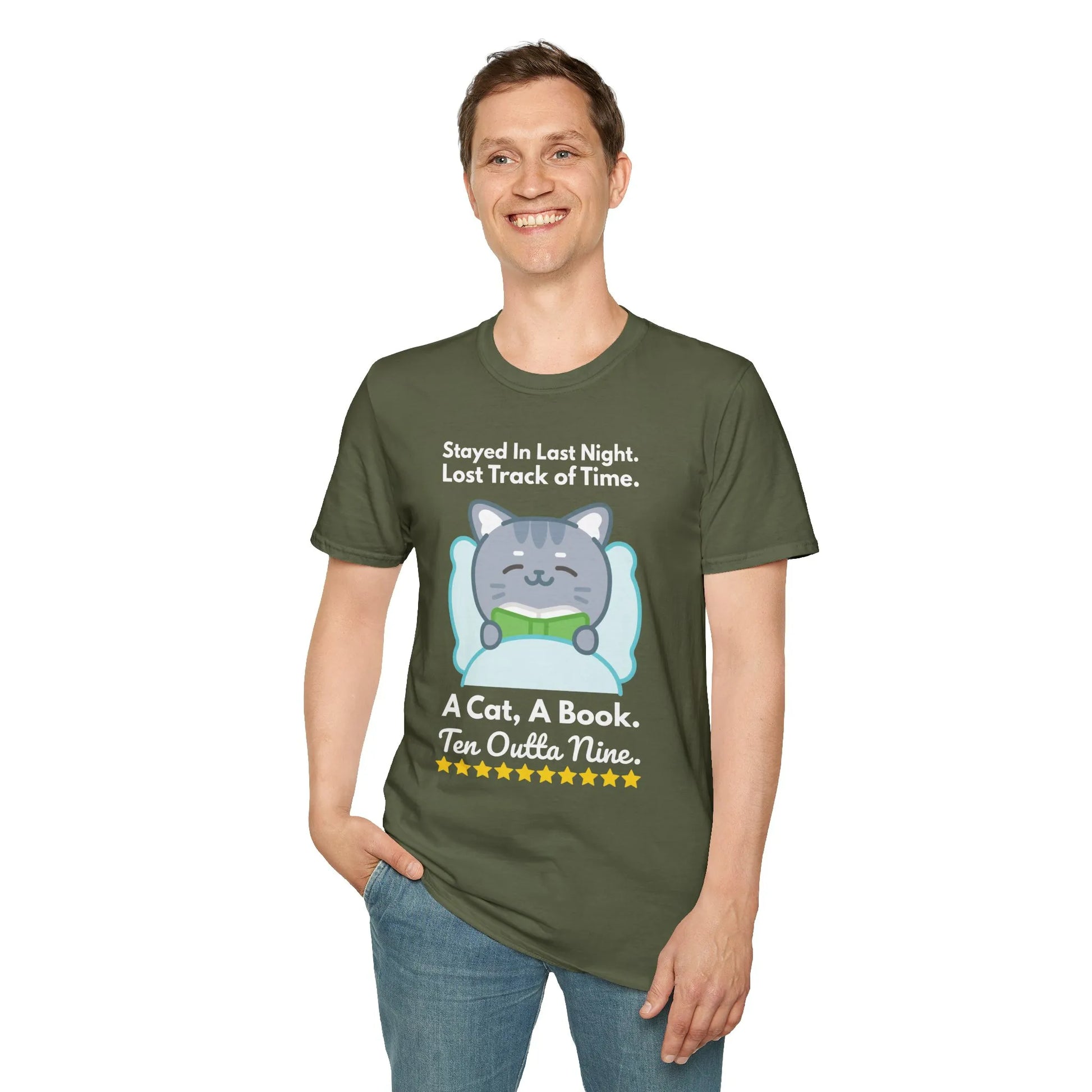 Man wearing a cozy green book lover t-shirt featuring a cute cat, bed graphic, and playful text for bookworms.