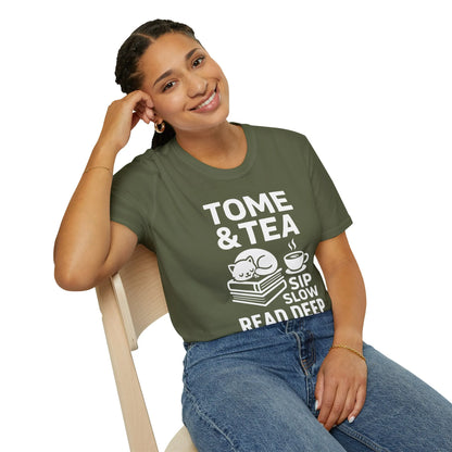Cozy Tome & Tea shirt featuring a napping cat, books, and a steaming cup, perfect for book lovers and tea enthusiasts.