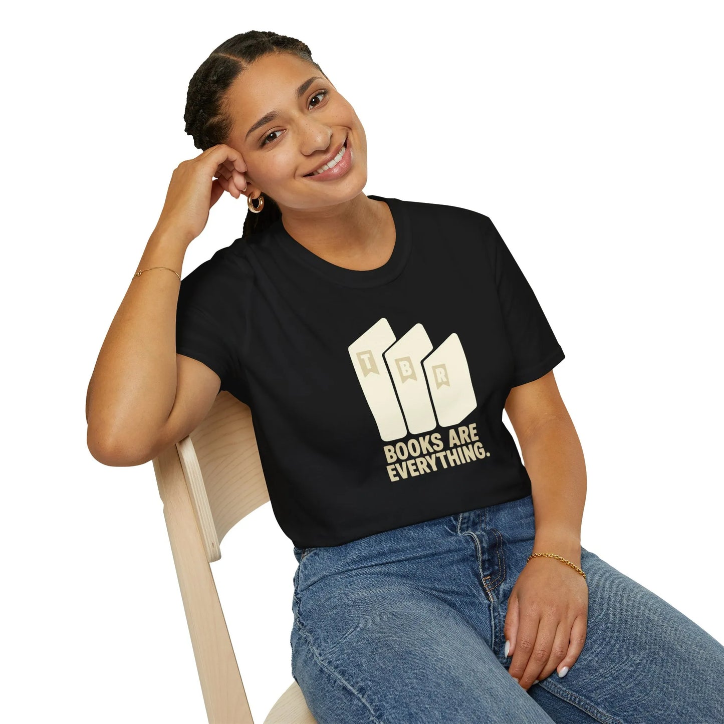 Relaxed fit Books Are Everything T-Shirt worn by a smiling woman, showcasing a love for reading in a cozy home setting, perfect gifts for book lovers.