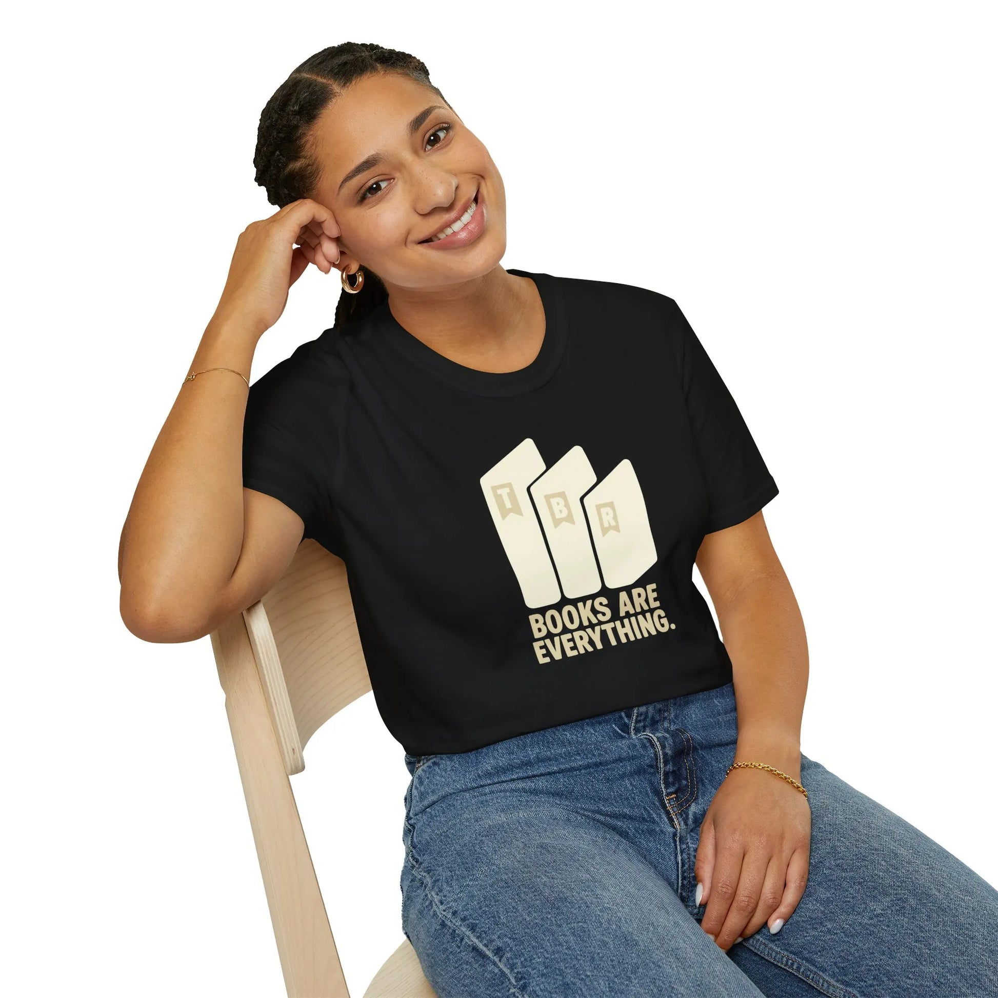 Relaxed fit Books Are Everything T-Shirt worn by a smiling woman, showcasing a love for reading in a cozy home setting, perfect gifts for book lovers.