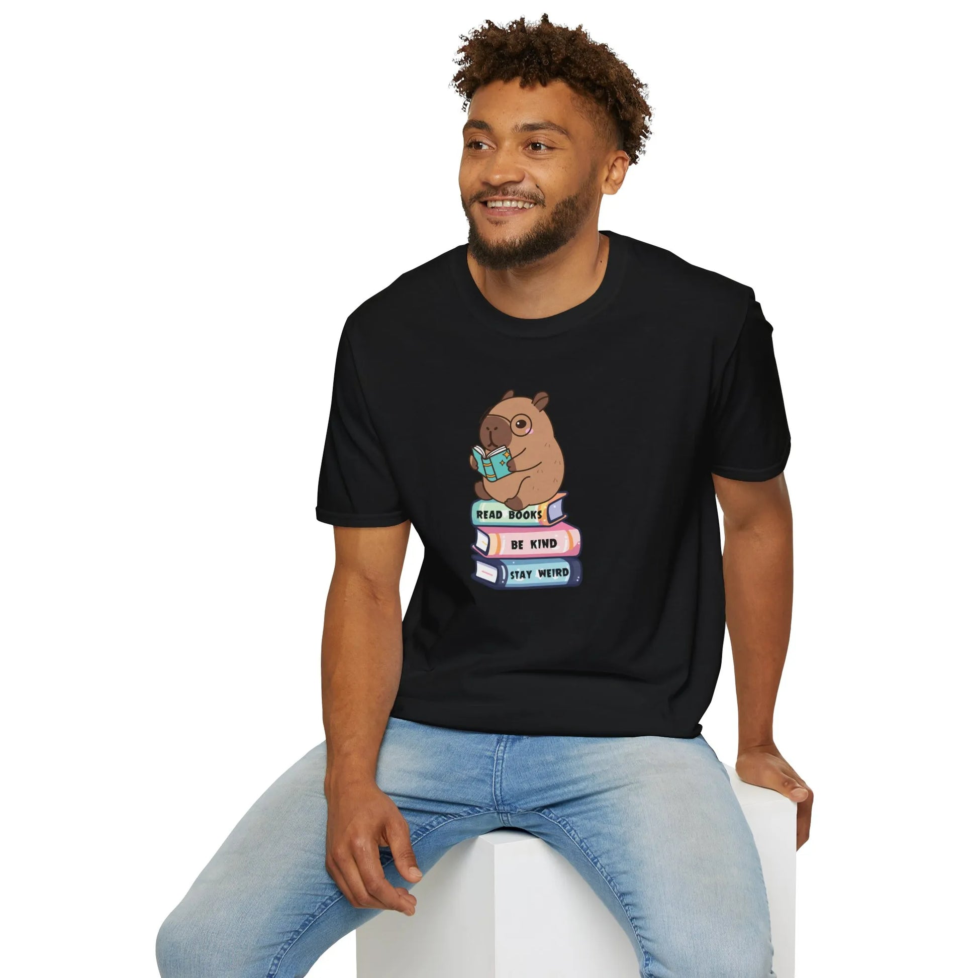 Capybara Reader T-Shirt with an adorable capybara on books, relaxed fit, perfect for readers and introverts. 📖