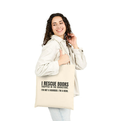 Woman happily holding an eco-friendly tote bag with "I Rescue Books" text for book lovers and collectors.